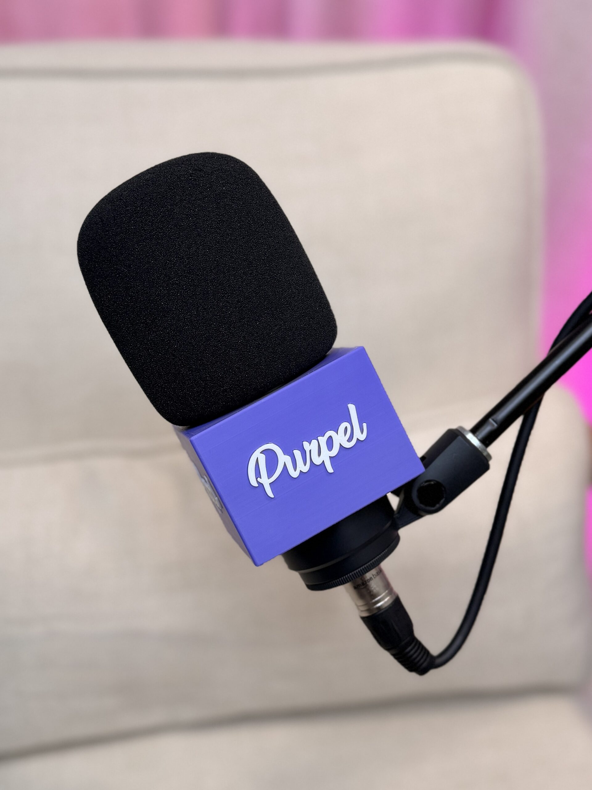 Custom podcast mic flag (mic cube) with Purpel logo on a Shure SM7B microphone